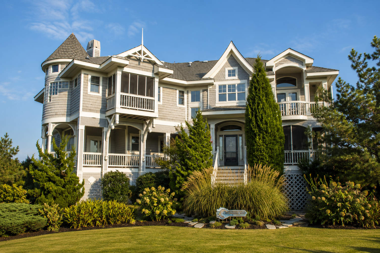 Turret and Arch coastal residence exterior by Dixon Design Build Group