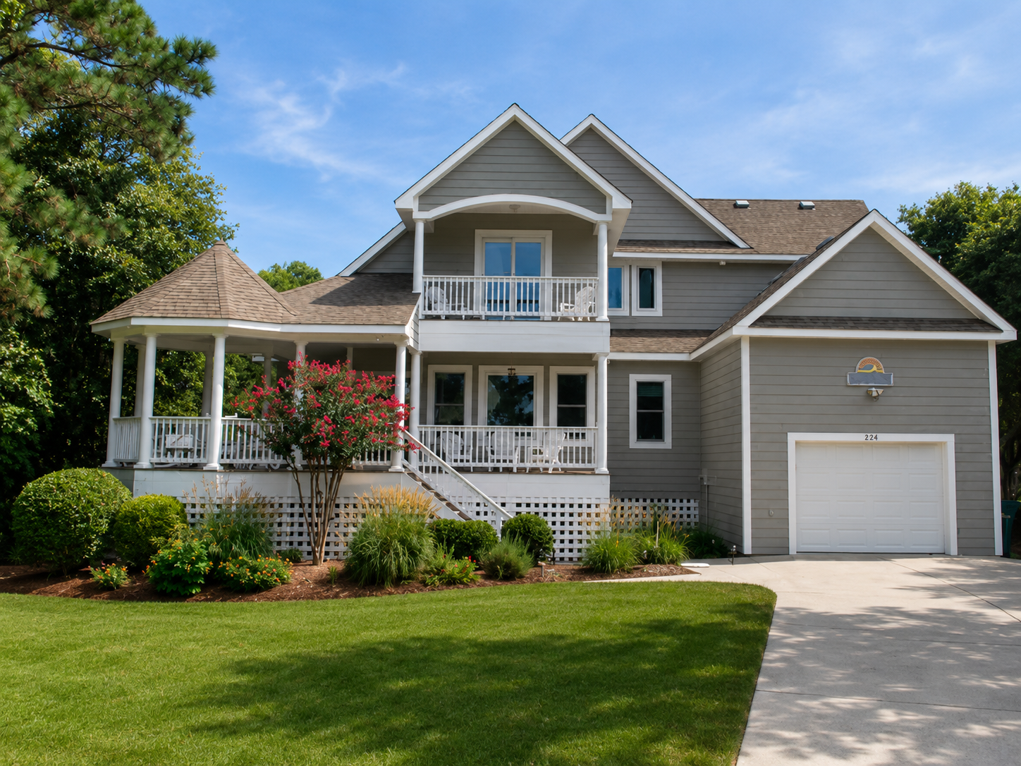 Coastal custom home with porches by Dixon Design Build Group